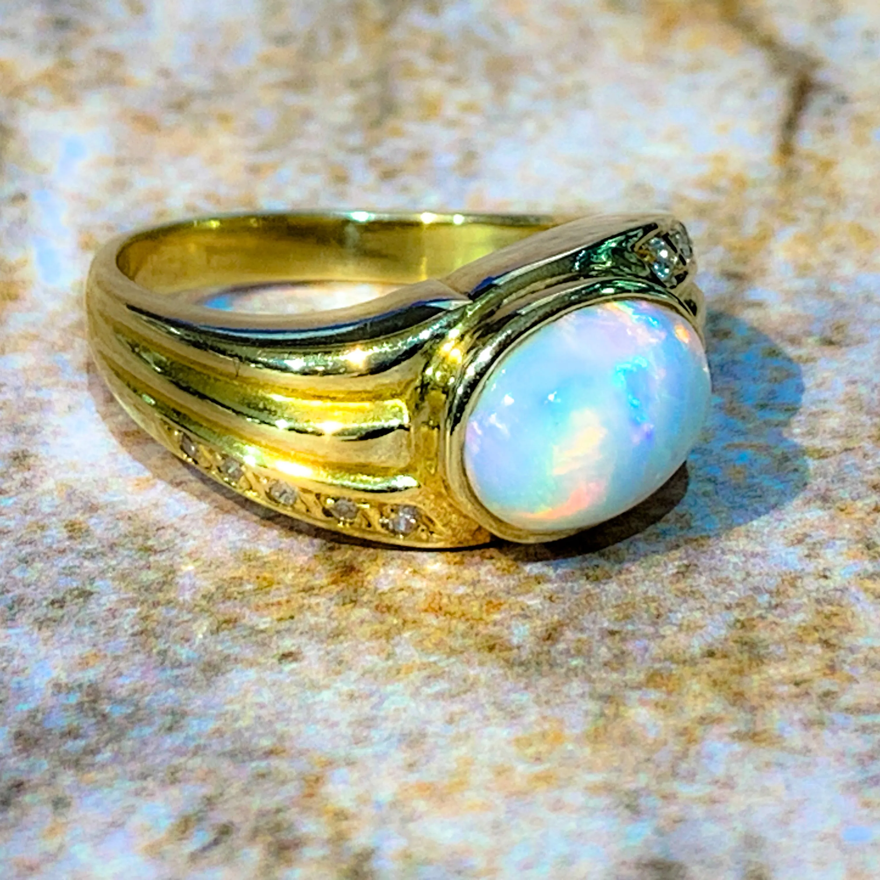 18kt Yellow Gold Multi colour Opal 9x7mm and Diamond ring