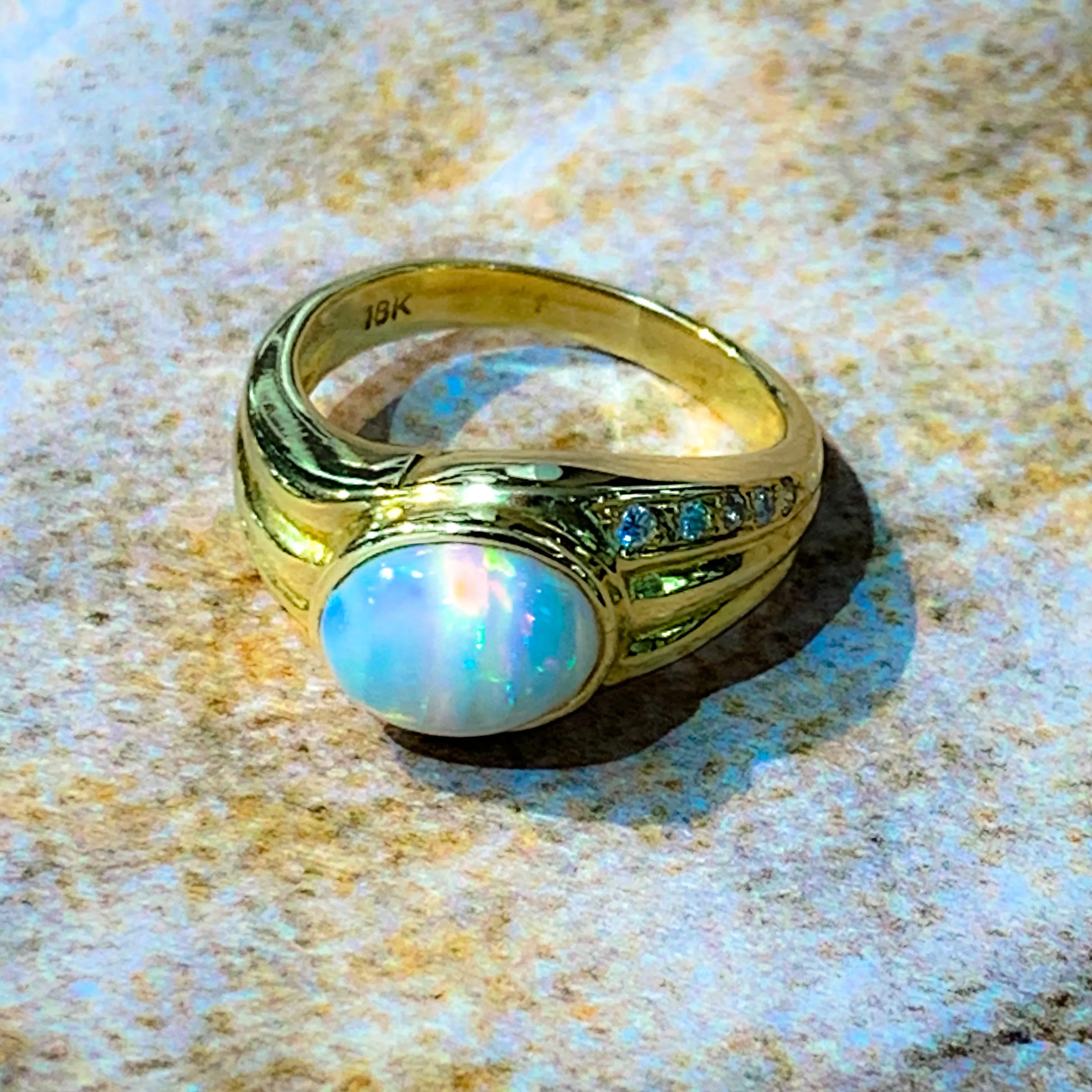 18kt Yellow Gold Multi colour Opal 9x7mm and Diamond ring