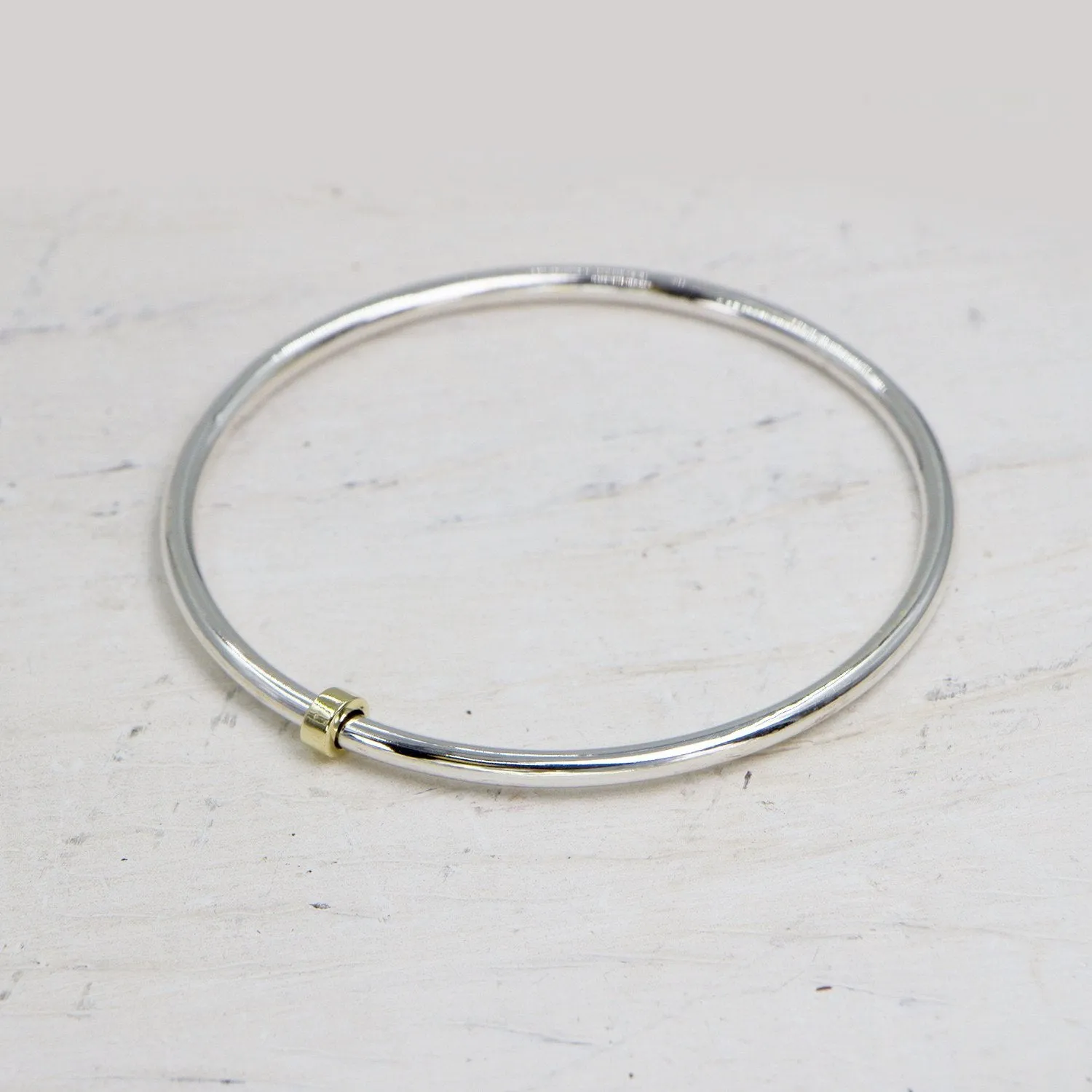 925 Silver bangle with little brass spinner - Size W6.5
