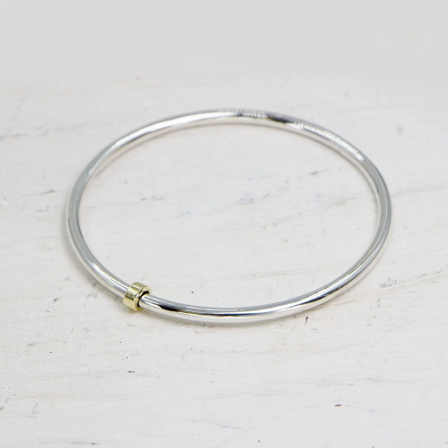 925 Silver bangle with little brass spinner - Size W7