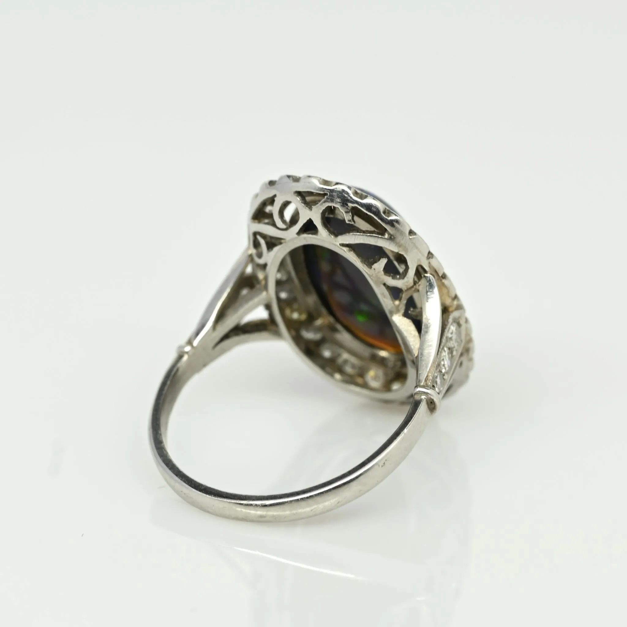 Edwardian Black Opal Cabochon and Diamond Halo Vintage Platinum Ring